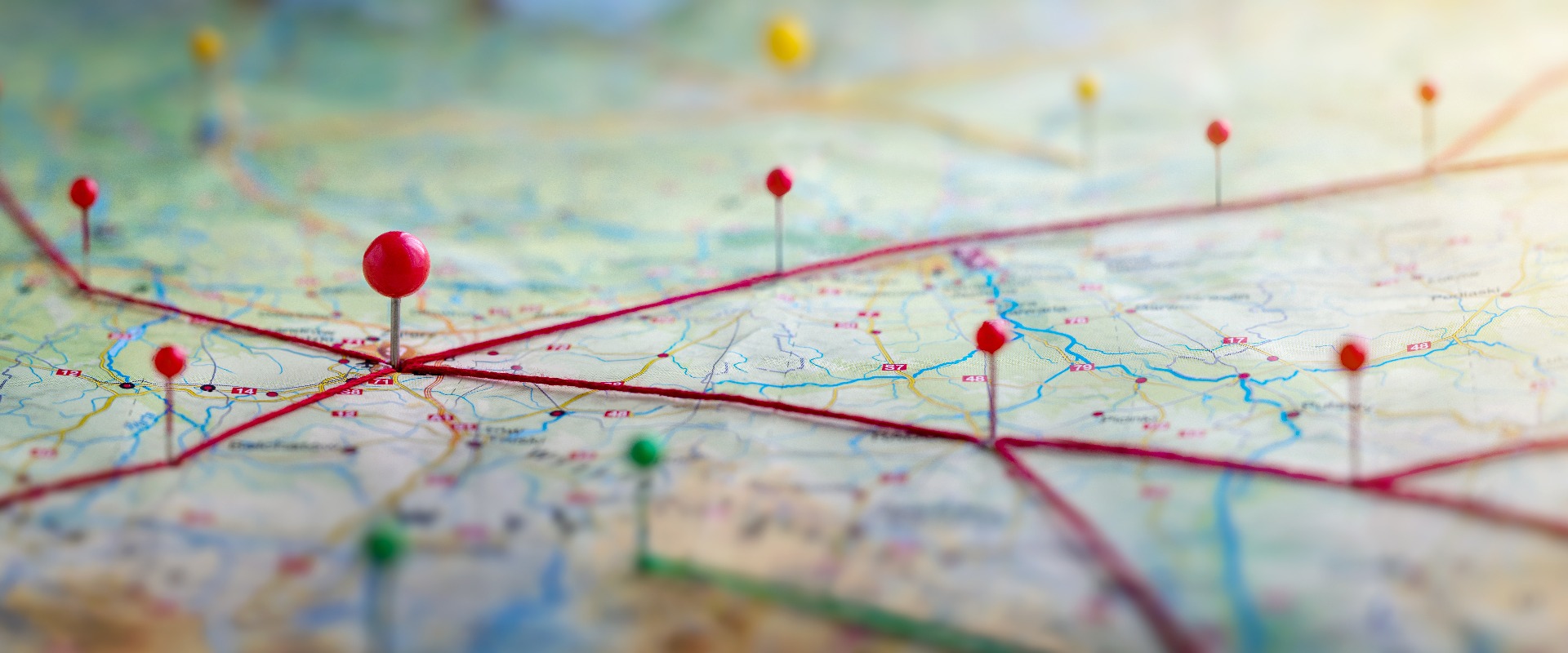 Find your way. Location marking with a pin on a map with routes. Adventure, discovery, navigation, communication, logistics, geography, transport and travel theme concept background.